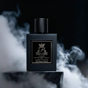 a black perfume bottle sitting on a rock surrounded by smoke in front of a plain black background